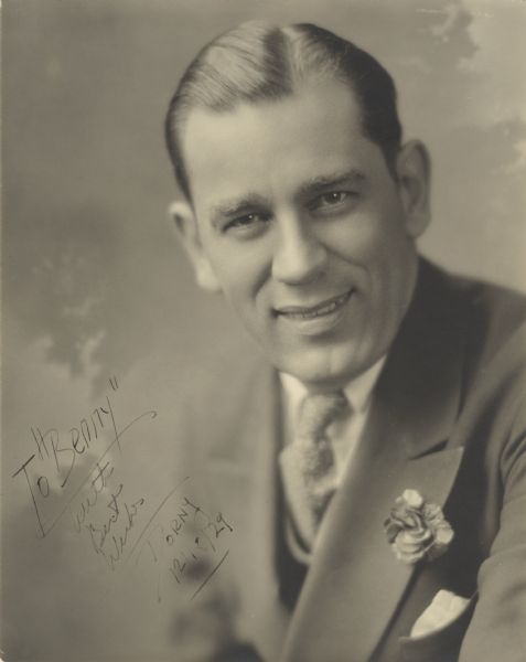 Quarter-length studio portrait of Werner "Dorny" Dornfeld, a Chicago area magician who was a leader in several national organizations of magicians. The "Benny" referred to in the autograph is Madison area magician Ben Bergor, who performed as Benny Golden Berger during the early years of his career.