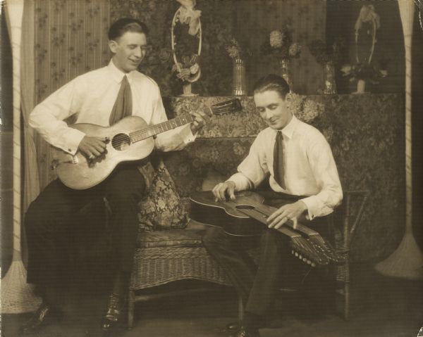 Jack Penewell of Madison, originator of the twelve string Hawaiian guitar (or so his business card says), with another musician tentatively identified as Ted Miller.