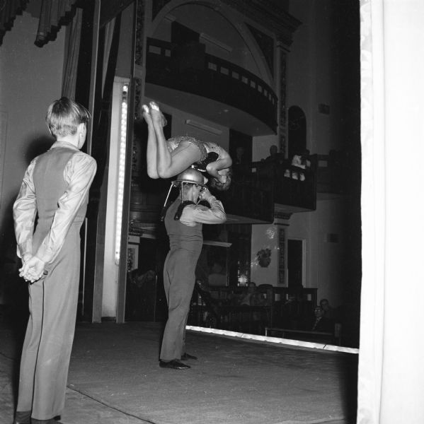 The Wisconsin veterans homes and hospitals regularly enjoyed entertainment provided the Madison Elks via Ben Bergor's entertainment agency. The performances were generally circus or vaudeville acts. View from backstage as a team of acrobats performs.
