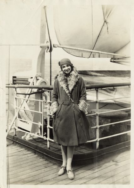 Dorothy Dignam, one of the first women in the advertising field, worked in Chicago, Philadelphia, and New York City, and was active in raising the status of women in the profession. In this photograph, she seen is seen on board ship, the S.S. "Geo. Washington," returning from Germany where she went to take part in the arrangements for the International Advertising Association convention.