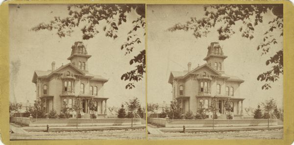 Stereograph of John Johnston's (1836-1904) first grand home, 1130 Grand Avenue. Johnston was a successful Milwaukee banker, who moved to "The Lion House" at 645 Franklin Place in 1896.