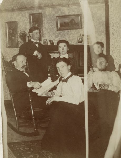 Group portrait of the Rogers family. Pictured are William Henry Rogers, Clark M. Putnam, Maude Rogers, Martha Rogers, Grace (Rogers) Putnam and Mrs. William Henry (Martha Snow) Rogers.