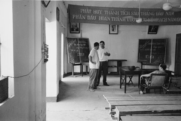 Men in the Communist Party meeting room in the Hanoi hotel where American journalist David Schoenbrun was staying.