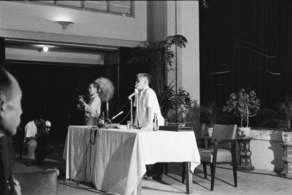 Press conference held at the International Press Club in Hanoi to announce the destruction and loss of life in the American bombing of Hue Street in a residential area of the city. The conference was attended by David Schoenbrun, an American journalist, who took this photograph.
