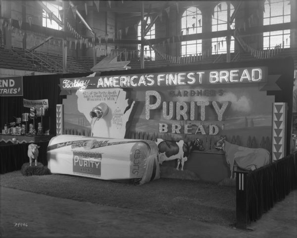 The Gardner Bakery Company booth at the Wisconsin Centennial Industrial Exposition held in the University of Wisconsin-Madison Field House.