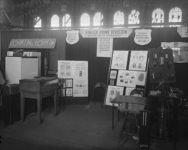 The Madison Police Department Fingerprint Booth at the Wisconsin Centennial Industrial Exposition held in the University of Wisconsin-Madison Field House.