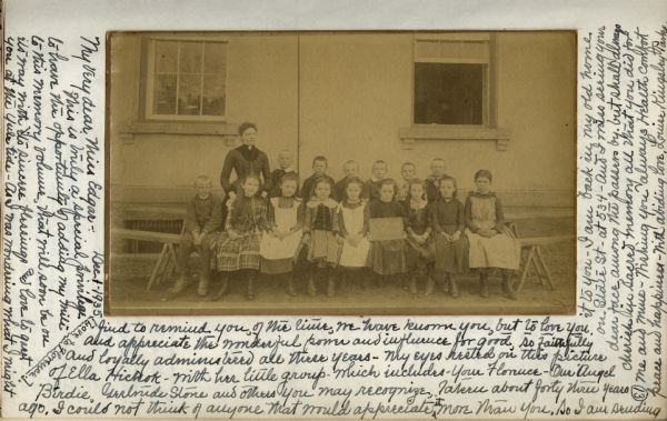 Vintage photograph, dated ca. 1890, with a wraparound handwritten message from Miss Louise Parke to her beloved teacher, Miss Mary L. Edgar, is part of a Memory Book. The teacher in the photograph was Miss Ella Hickock, but all the pupils in the picture graduated under Miss Edgar. The Memory Book was created by a Committee of Friends of the Washington School to commemorate her retirement after 50 years. It was mailed to Miss Edgar at her new home in California after her retirement.