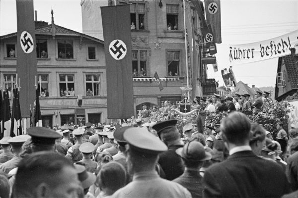 A crowd of civilians attending a Nazi rally in Danzig.