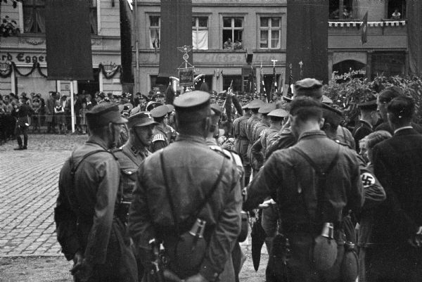 Soldiers watching a Nazi rally in Danzig from which American correspondent Alvin Steinkopf was reporting for the Associated Press in 1939.