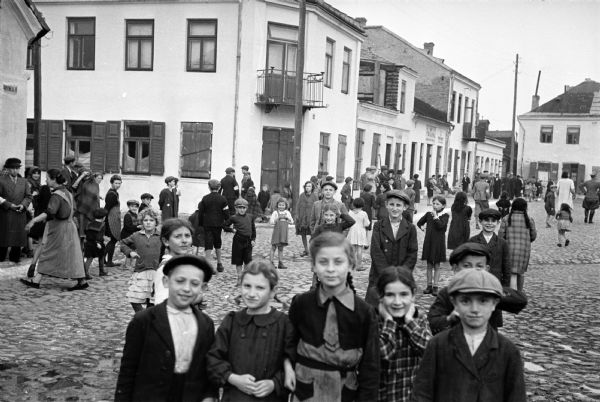 Street scene in the Jewish ghetto in Szydlowiec, Poland, photographed by American journalist Alvin Steinkopf, about one year after the German invasion.