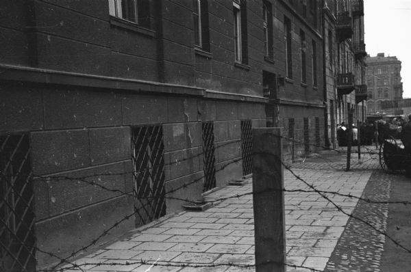 A barbed wire fence in the Jewish ghetto in Warsaw constructed to quarantine people infected with lice. At this point the wall around the entire ghetto had not been built.