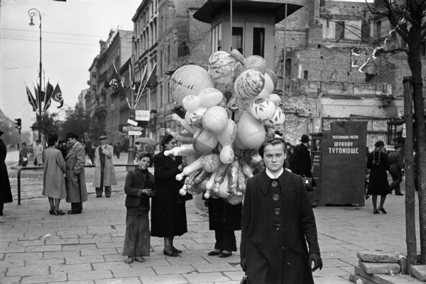 Vendor selling balloons near the central railroad station in Warsaw, Poland, about one year after the German invasion.