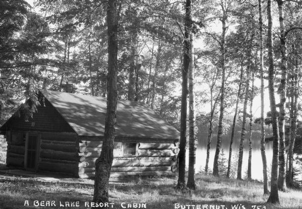 A small log cabin located in the woods near Bear Lake in either Ashland or Iron County.