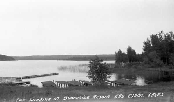 Numerous boat docks along shoreline of one of the Eau Claire Lakes.