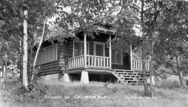 Log cabin with a porch in the woods near the Eau Claire Lakes in southwest Bayfield County.