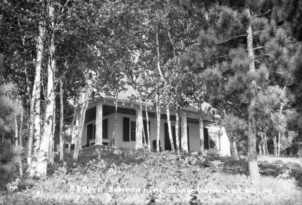 View of the A.F. Boyd summer home through the trees.