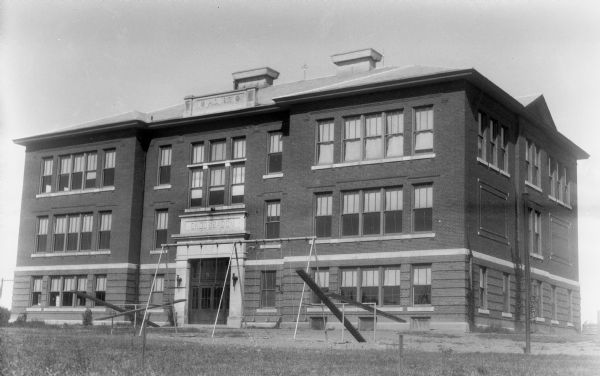 Exterior view of the Ondossagon Public School building. This three-story brick structure was built in 1917.
