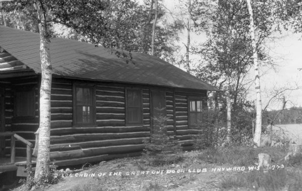 View of a one-story log cabin, part of the Great Outdoor Club on North Lake.