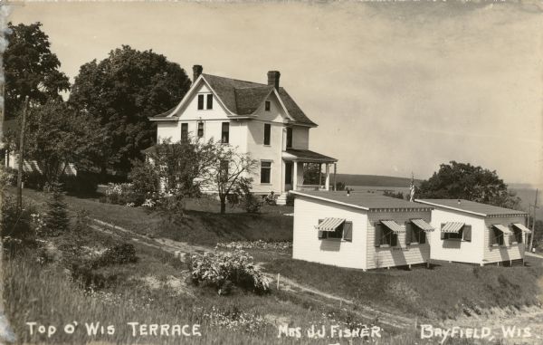 House, cottages and property of Mrs. J.J. Fisher overlooking Lake Superior.
