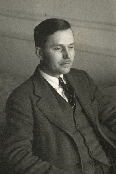 Informal portrait of Association Press correspondent Ernest G. Fischer while he was held at Bad Nauheim during World War II. Fischer's papers are part of the Mass Communication collections at the State Historical Society of Wisconsin. The photograph was taken by his fellow internee Alvin J. Steinkopf whose papers are also at Wisconsin.