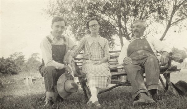 Alvin Steinkopf (left), a Milwaukee journalist, dressed for work on the farm of his parents, Mathilda and Oscar Steinkopf. The Steinkopfs farmed 40 acres near Luck.