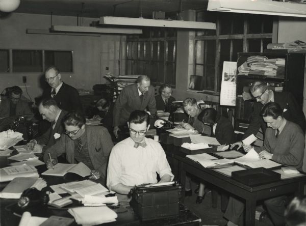 The London office of the Associated Press, with Alvin Steinkopf working at his typewriter, center rear.
