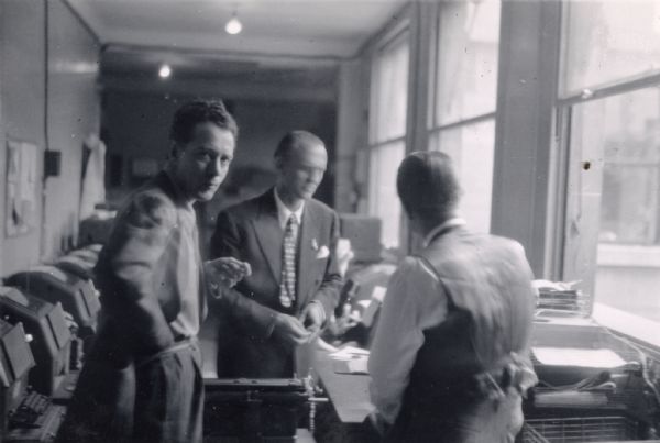 Correspondents in the Paris office of the Associated Press. Only Tom Williams, who is looking toward the camera, has been identified.