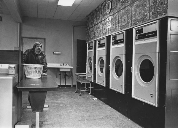 "Theresa Laundromat. Dave Hanke patiently waits for his laundry."