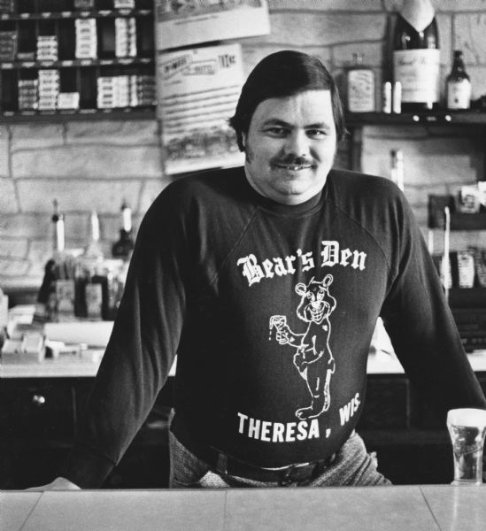 "Carl 'Bear' Bandle, proprietor of Bear's Den, is one of Theresa's youngest barkeepers."