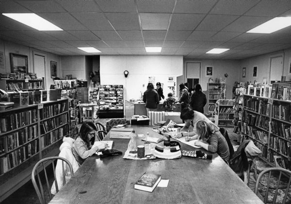"Library. Situated above the firehouse. Librarians Nancy Koll and Judy Scheirer estimate that they have about 5,000 books and periodicals."