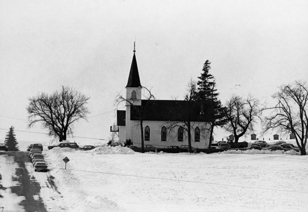 "Zion Lutheran Church, Town of Theresa. At this moment, funeral services of Herb Sellnow are taking place."