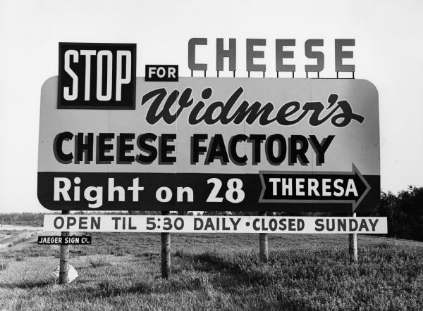 "This Widmer Cheese Factory sign was visible to travelers south bound on Hwy 41. It stood near the present day rest area, near the Hwy 28 turn off."