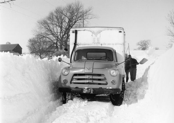 "The Widmer milk truck gets bogged down in the Bill Breitag driveway, north of Theresa."
