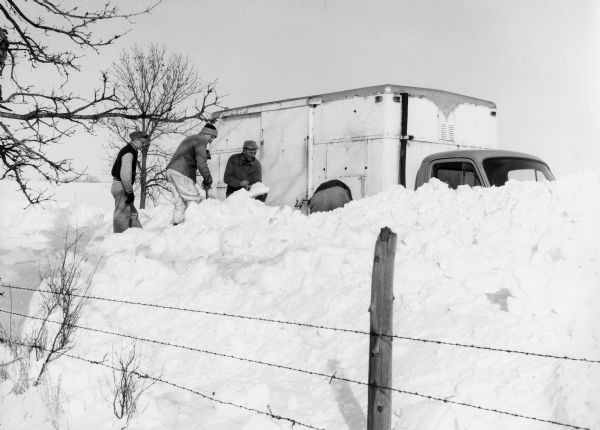 "Digging out the milk truck in the Breitag Road."
