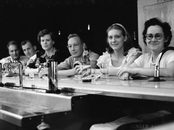 "Patrons at Koecher's Bar are L-R, Clyde Bandlow, Gene Greiner, Bea Greiner, Oliver Justman, Dottie Justman, & Rita Koecher."