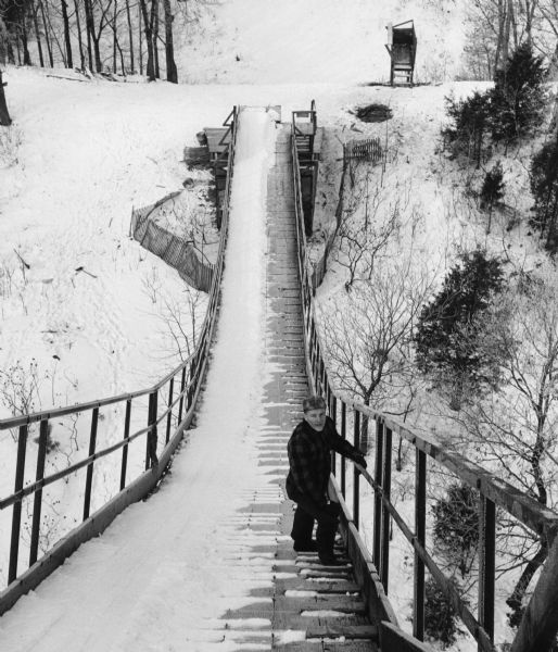 "This ski hill was a popular attraction located near Oconomowoc. Ward Woltman of Oak Grove is on the jump."