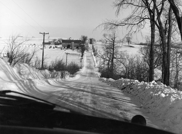 "This is Doyle Road, looking north, near where it intersects with Allen Road." Taken through the windsheild of the photograhper's car.
