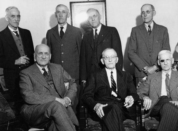 "The seven Bodden brothers; (front L-R) Frank, Michael, Jacob, (back) Ernest, Hubert, Henry, & Ed."