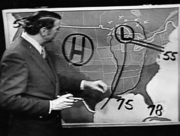 "TV weather man, Howard Gernette did his thing on an early weather map."