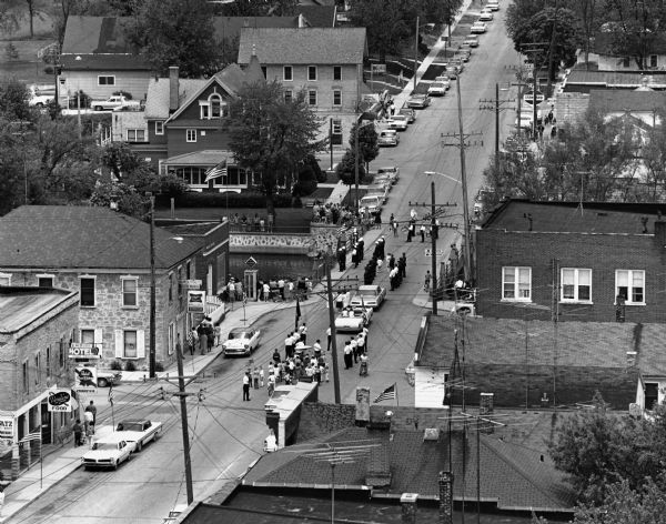 Elevated view of a parade in downtown Theresa.