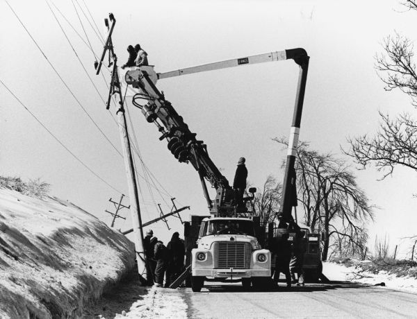 "Crews begin the cleanup after the ice storm."