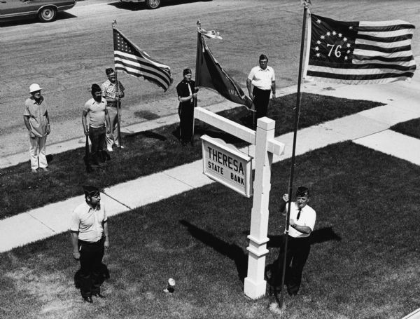 "Members of American Legion Post 270, present a Centennial Flag.  Oliver Krueger is at the flag pole."