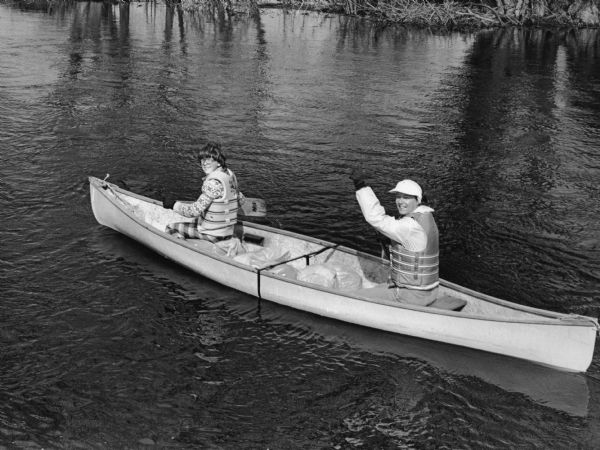 "Joan Glaab and her son, of Brownsville, start on a boating trek down the Rock River."