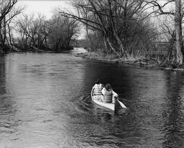 "Joan Glaab and her son, of Brownsville, start on a boating trip down the Rock River."
