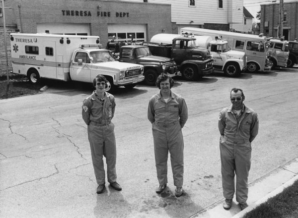 "Gene Koll, Bob Bogenschneider, and Gene Lackas pose with Theresa fire equipment."