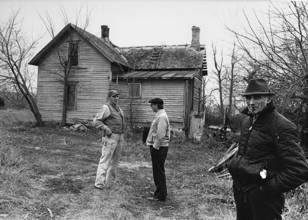 "Hubert Oechsner, Norm Grantman, and Peter Dogs were photographed at the Ziemer property."
