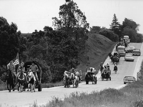 "Bill Zahn of Juneau organized this wagon train as it traveled on Y near Knowles."