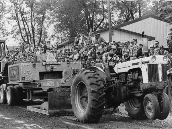 "It was billed as the 'Theresa Lions first tractor pull.' An overflow crowd of between 1600 and 2000 people witnessed the event according to chairman Jim Neitzel."