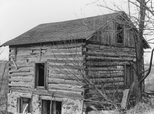"This old log house is located on Allen Road south of Theresa."
