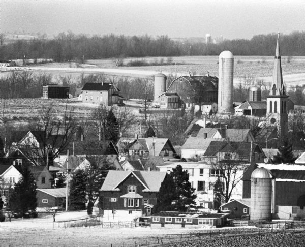 "This photo of Theresa was taken from the Ralph Bodden farm. The long 500mm mirror lens compresses the distance from the Paul Koll farm in the foreground to the Andrew Schnitzler farm beyond the Catholic Church."
